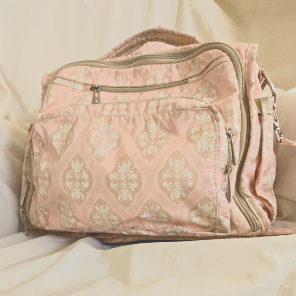 Ju Ju Be diaper bag with pacifier holder and accessory bag.